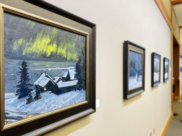 multiple paintings lined up