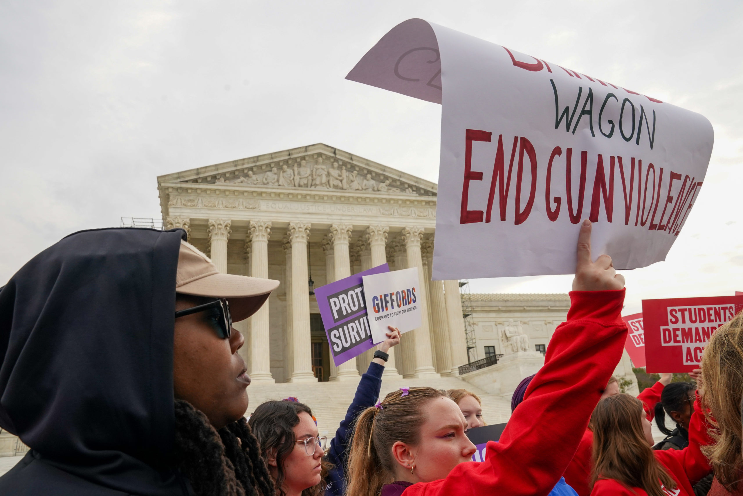 Gun safety and domestic violence prevention organizations hold a rally