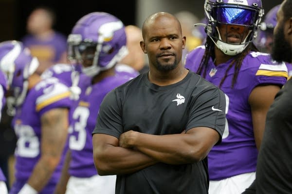 a man watches football players