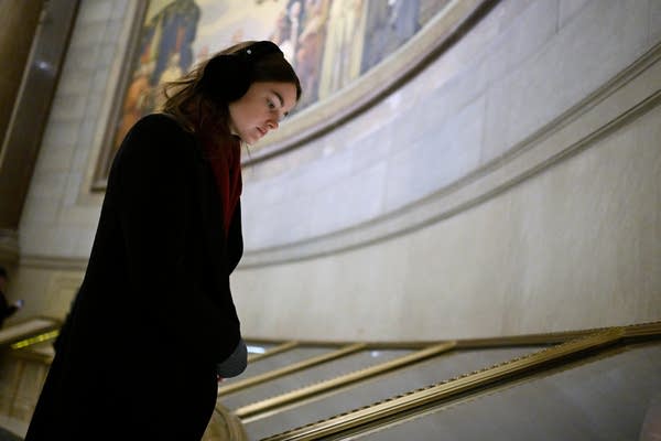 A woman looking at archieves in an exhibit