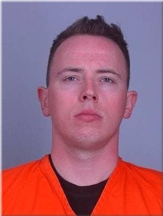 state trooper in jail jumpsuit