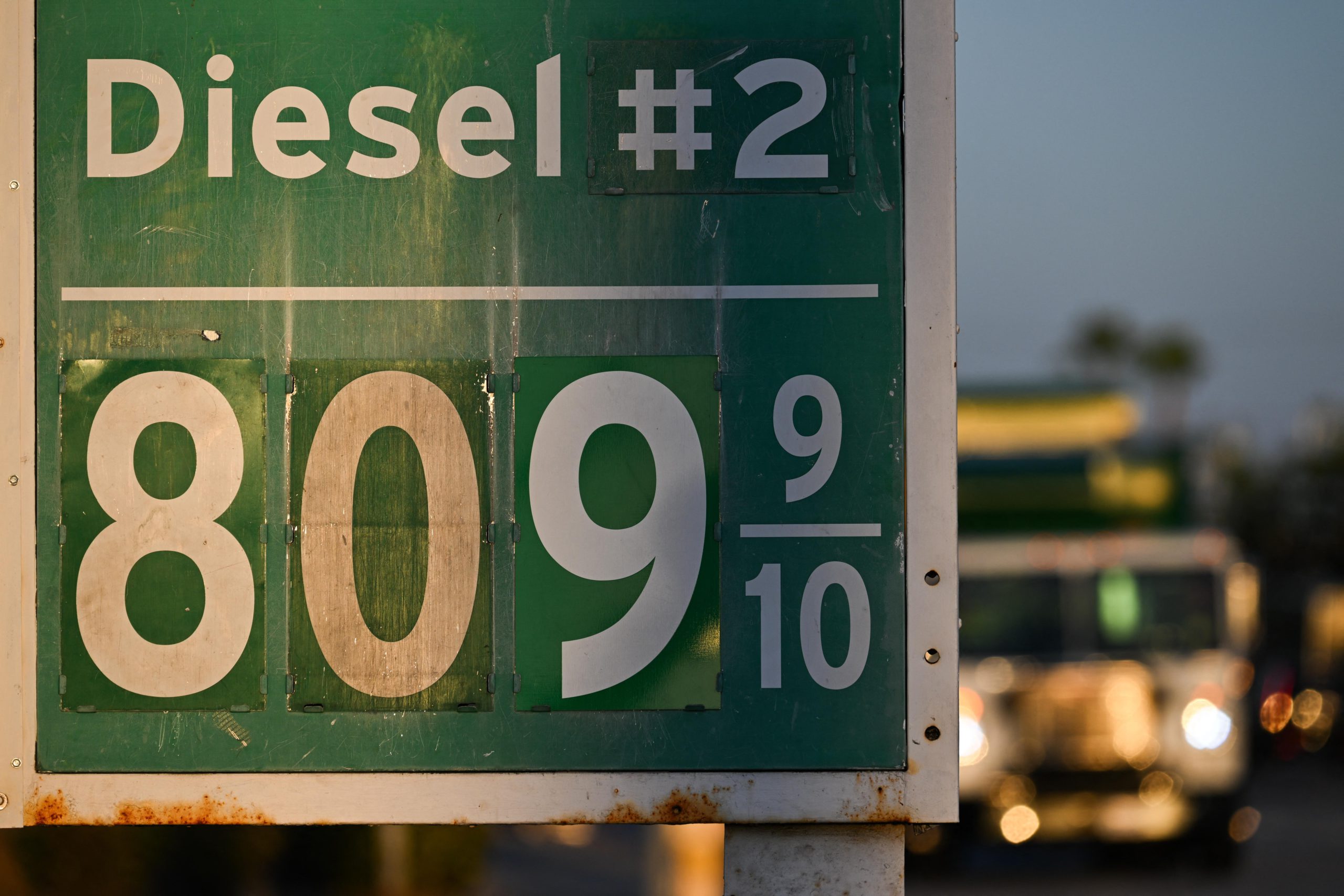 A green-and-white sign outside of a California gas station displays the price of diesel fuel at more than $8 per gallon.