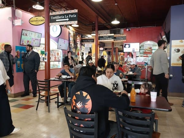 People eating a meal at a food court
