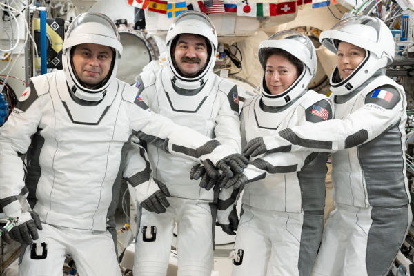 NASA's Crew-12 members gather for a portrait in the pressure suits they wore while departing the International Space Station inside the SpaceX Dragon spacecraft. From left, Roscosmos cosmonaut Andrey Fedyaev, NASA astronauts Jack Hathaway and Jessica Meir, and European Space Agency astronaut Sophie Adenot.
