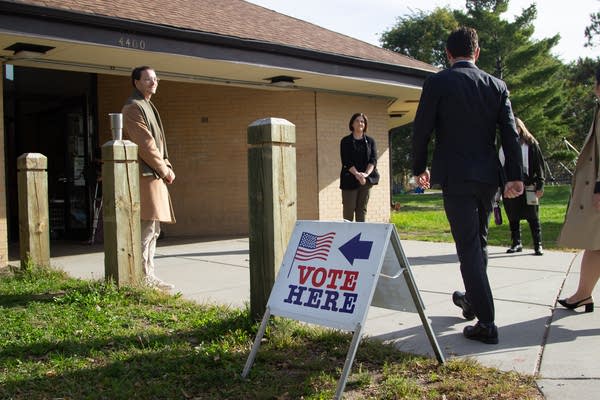 People outside a voting site