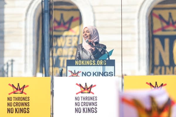 A woman speaks during a rally