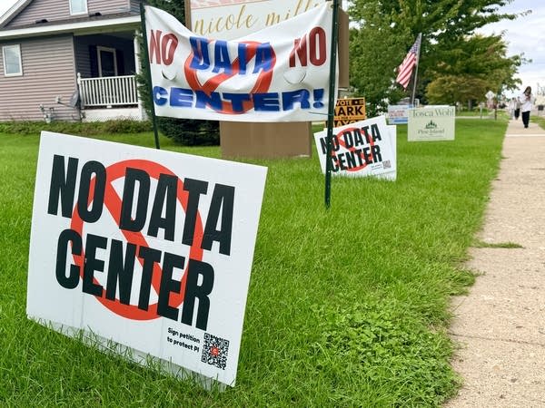 Yard signs saying 